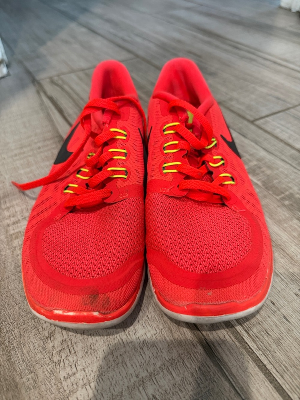 Nike Red Athletic Trainers with Black Swoosh and Yellow Eyelets